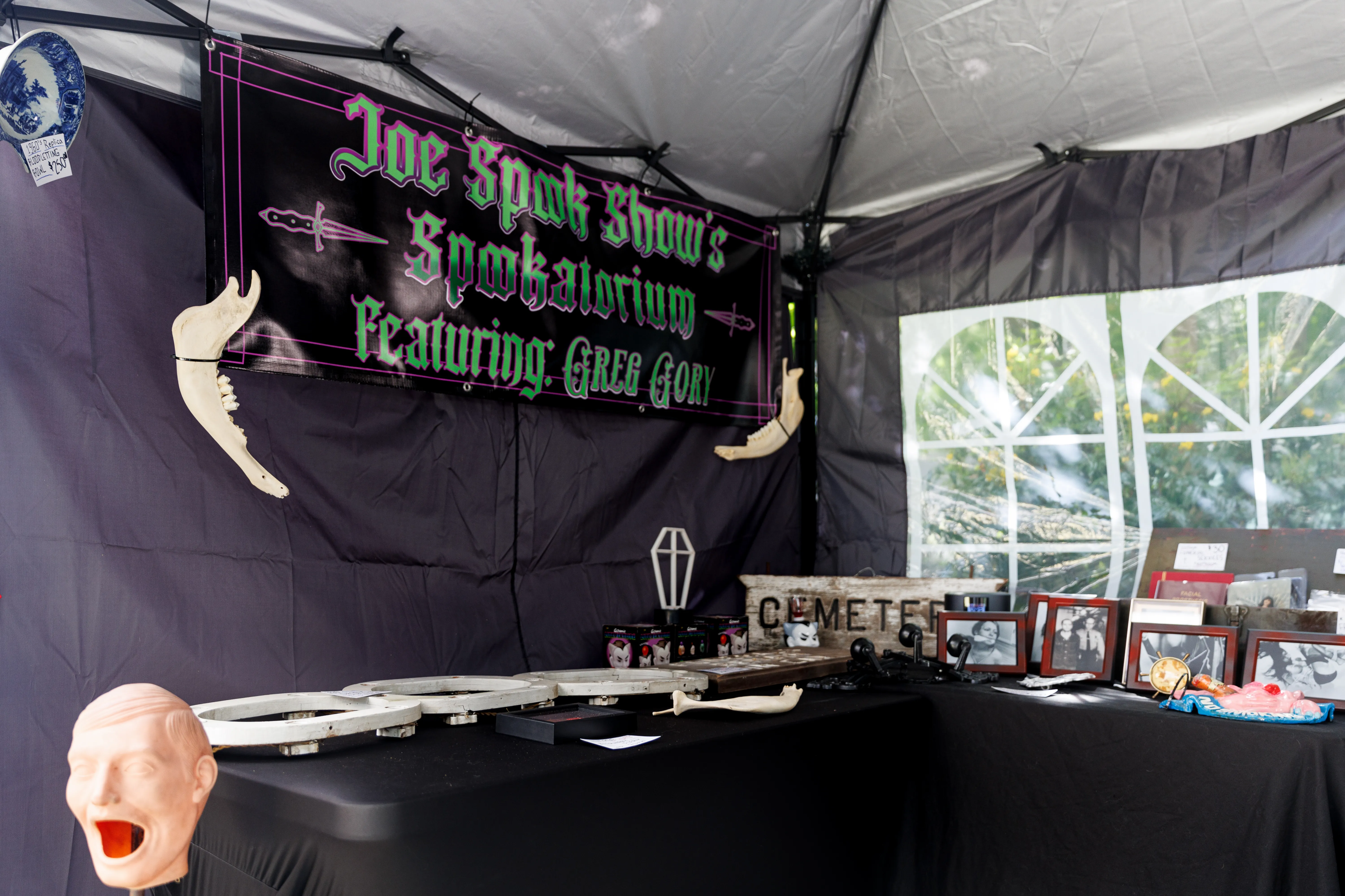 A banner reading "Joe Spook Show's Spookatorium" at the inaugural Speakeasy Market.