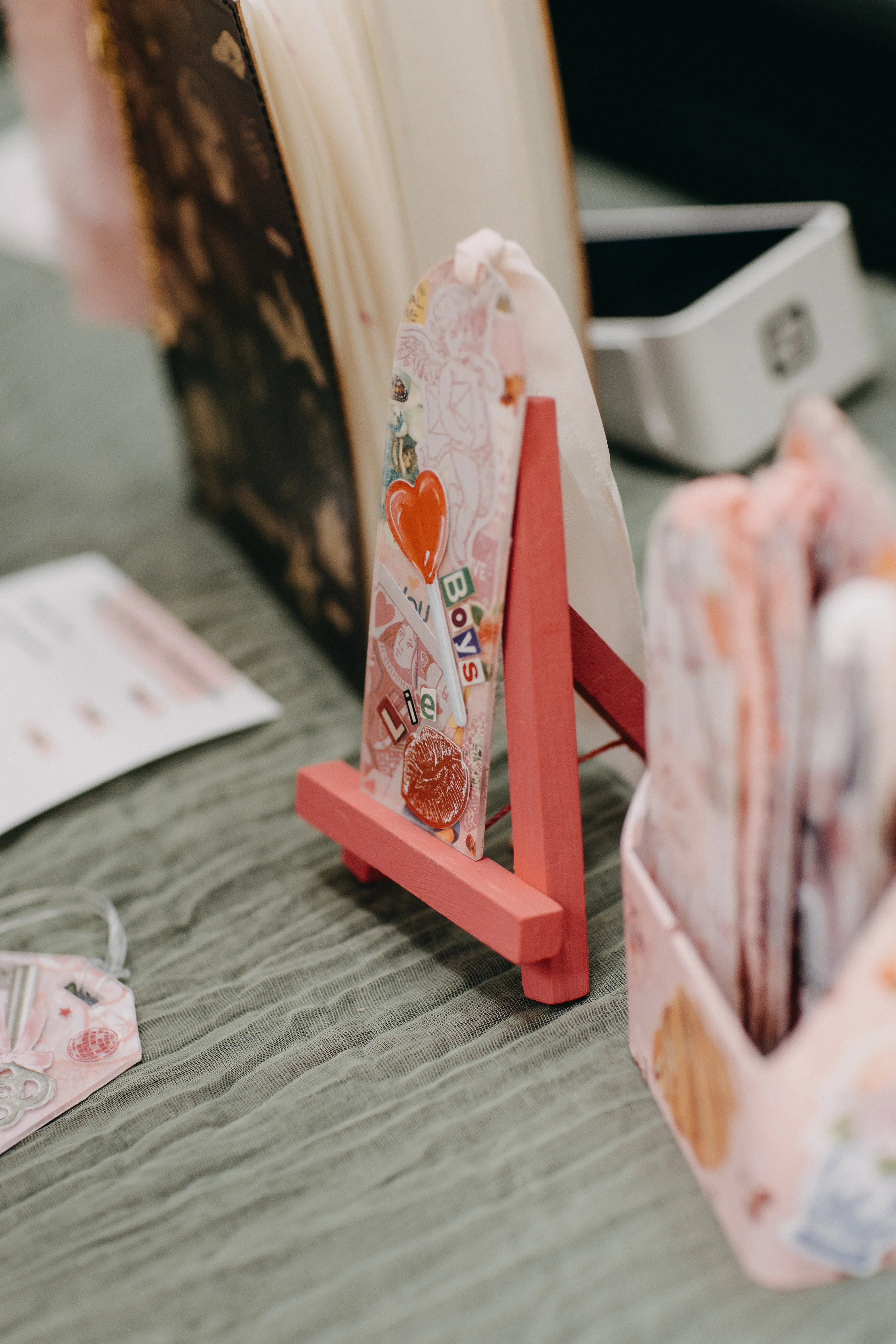 A bookmark that reads "Boys Lie".
