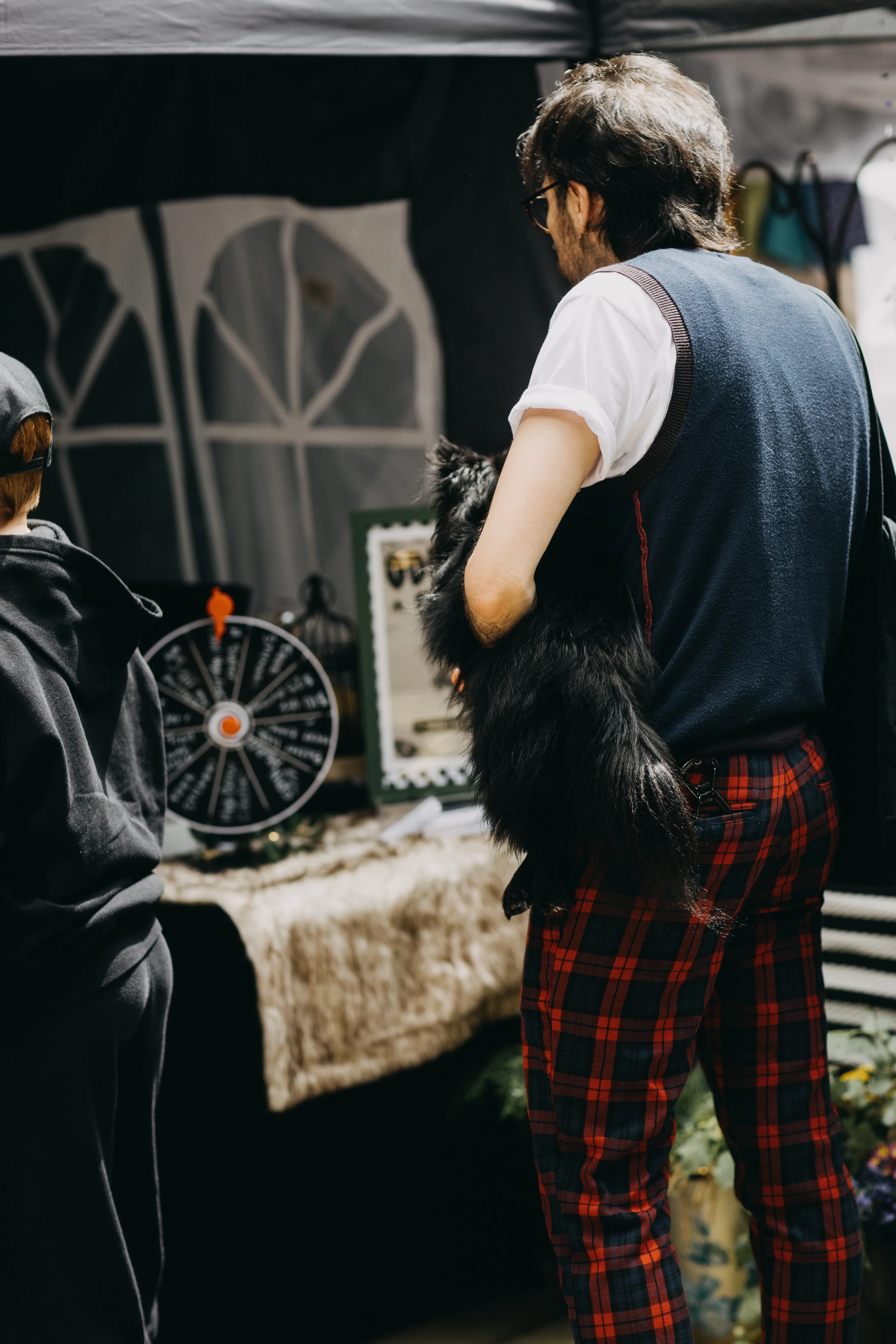 A customer and his dog checking out the market's celebration of the local subculture.