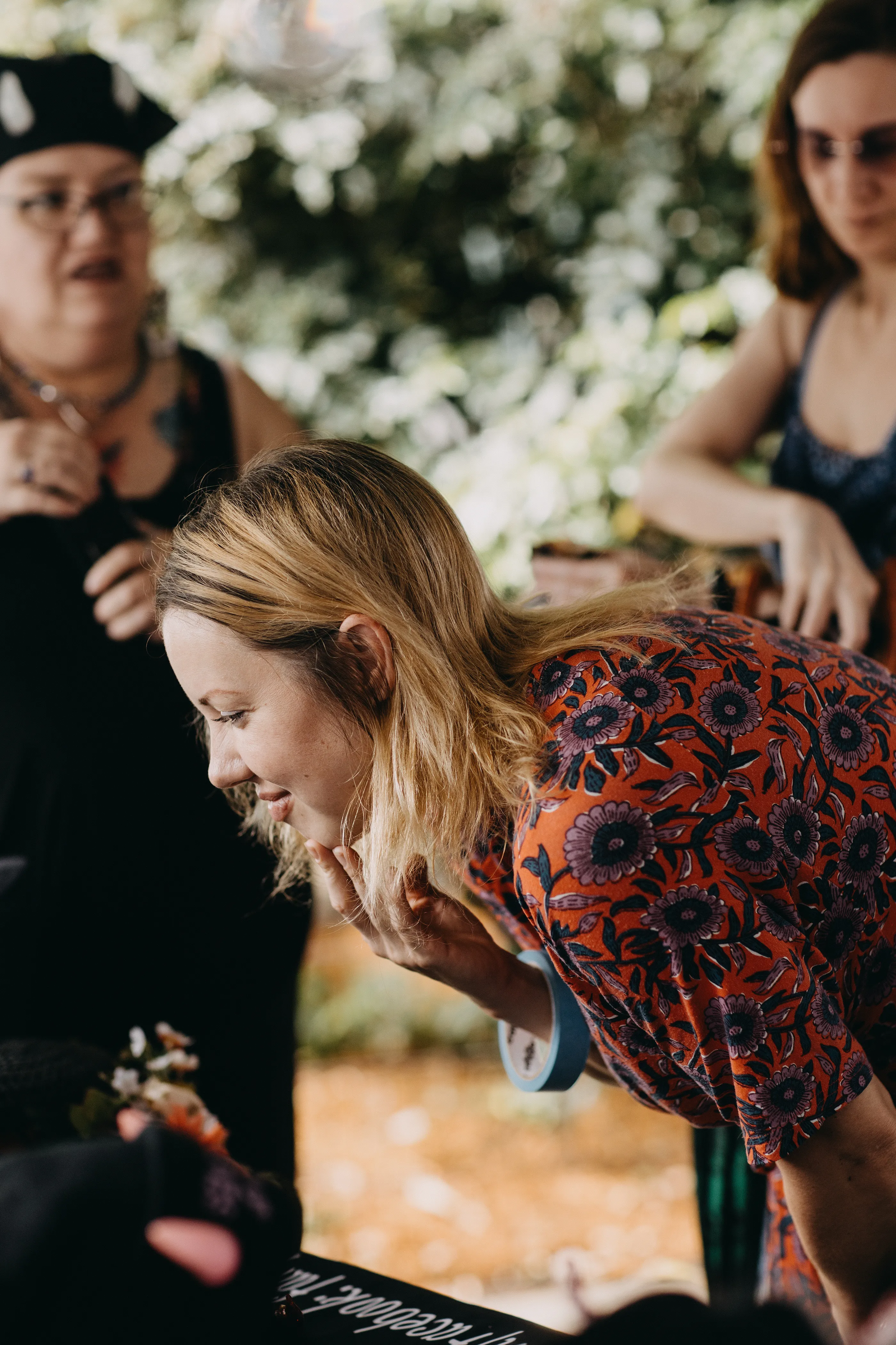 A customer joyfully admiring a table of oddities.