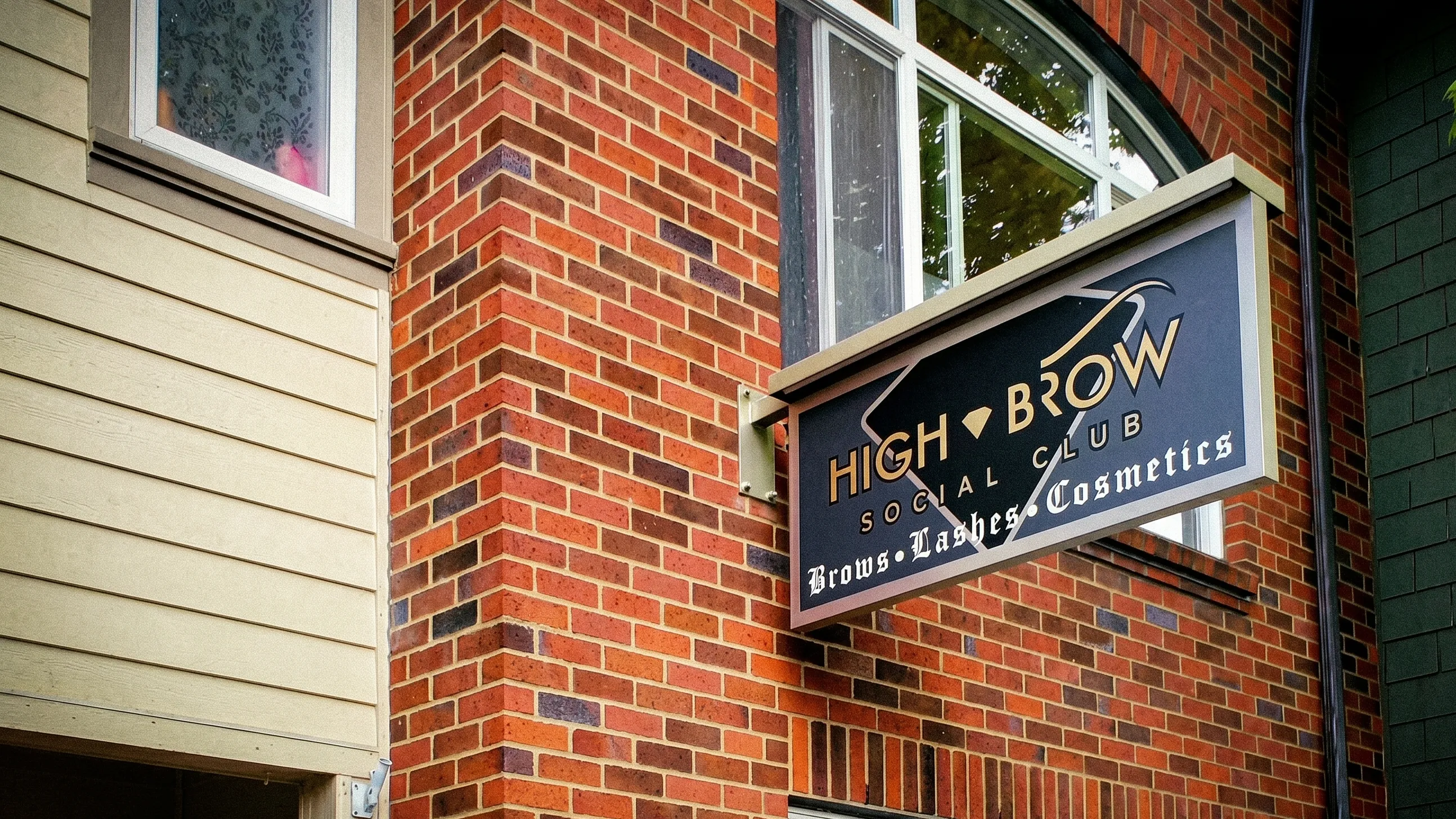 The original High Brow Social Club boutique sign