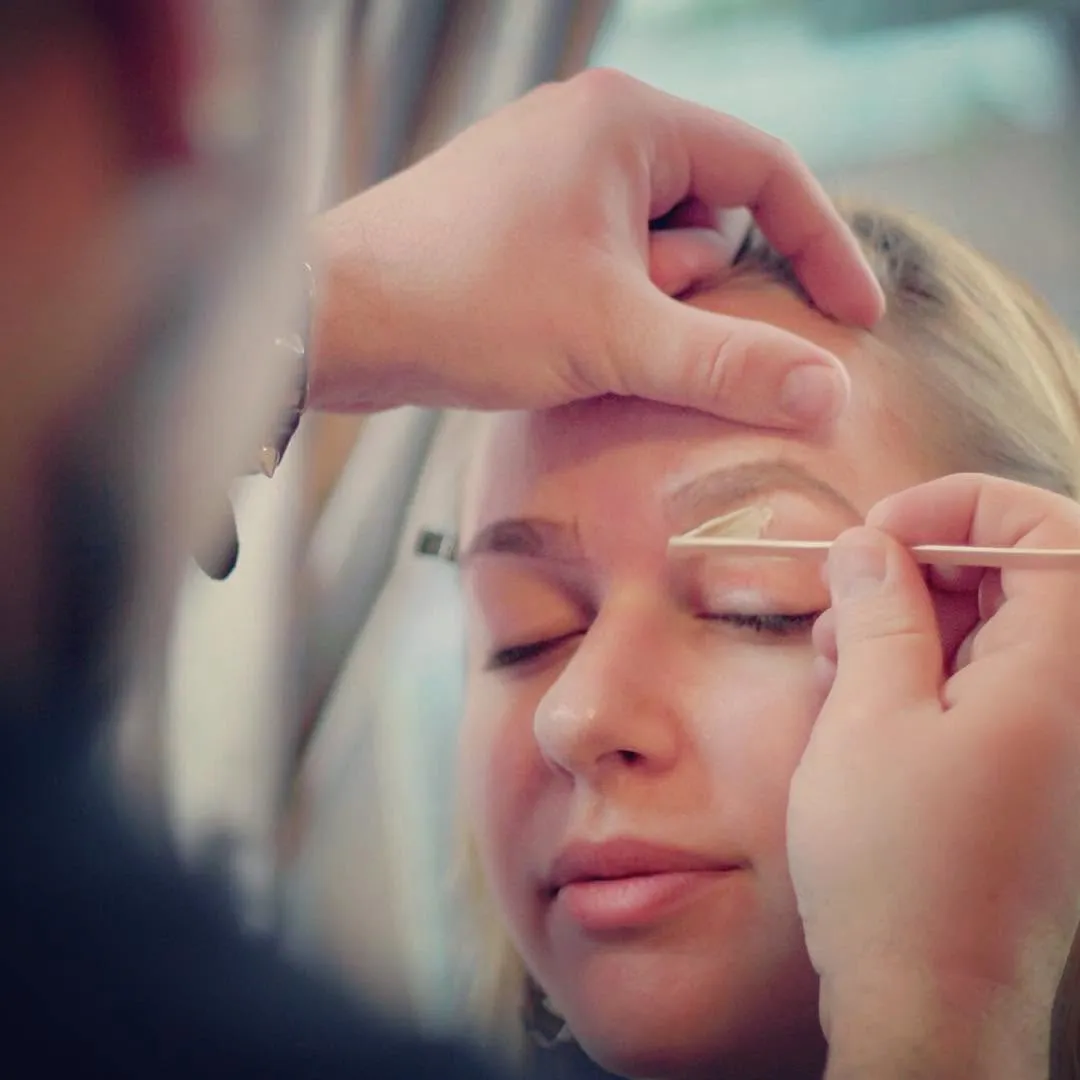 Joe Brows shaping a client's eyebrows