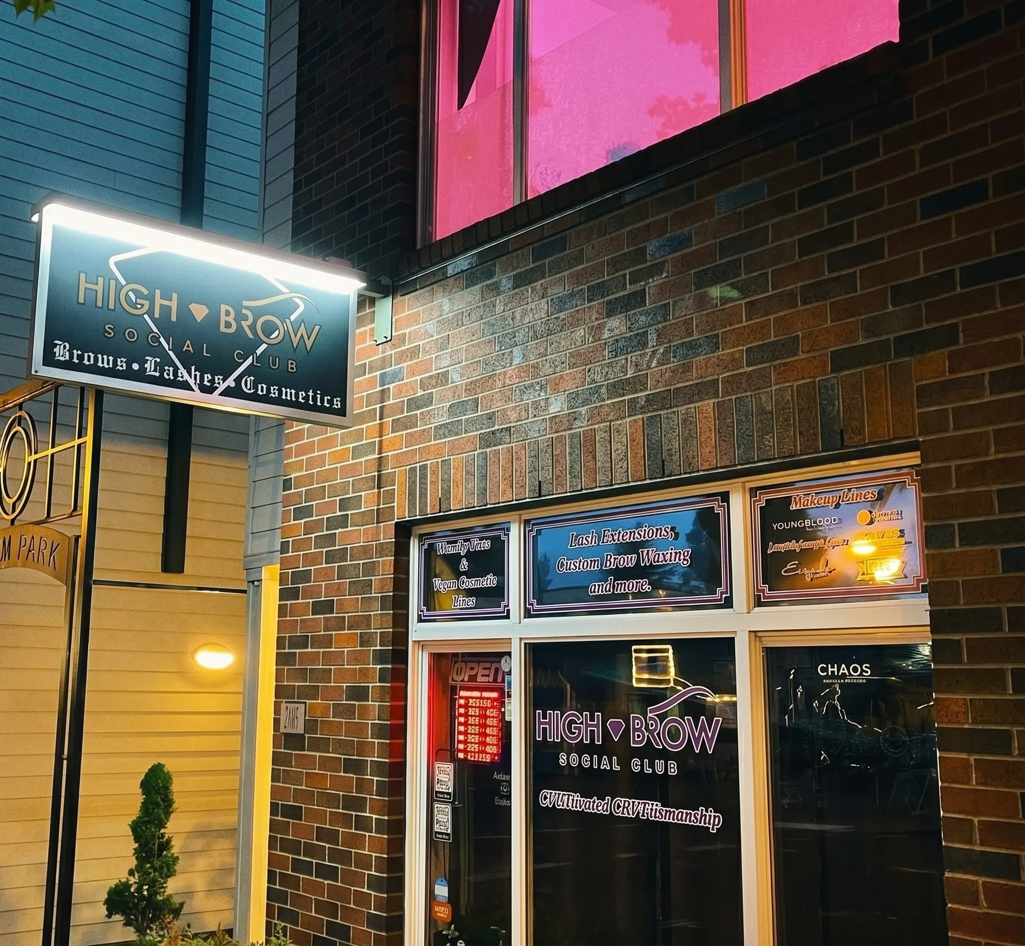 Original Main Street storefront lit at night