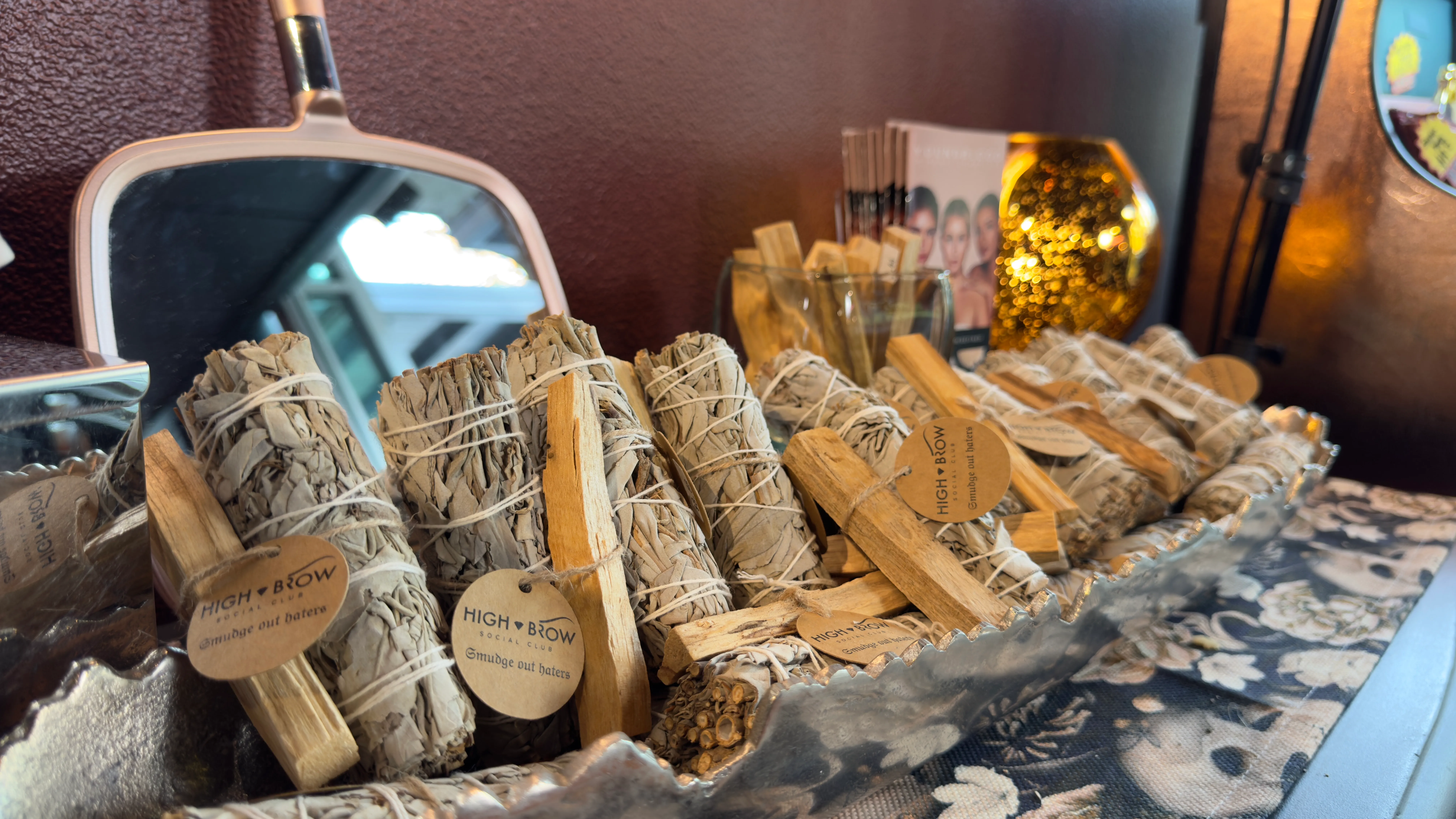 A display of High Brow Social Club's 'Smudge Out Haters' line of sage bundles